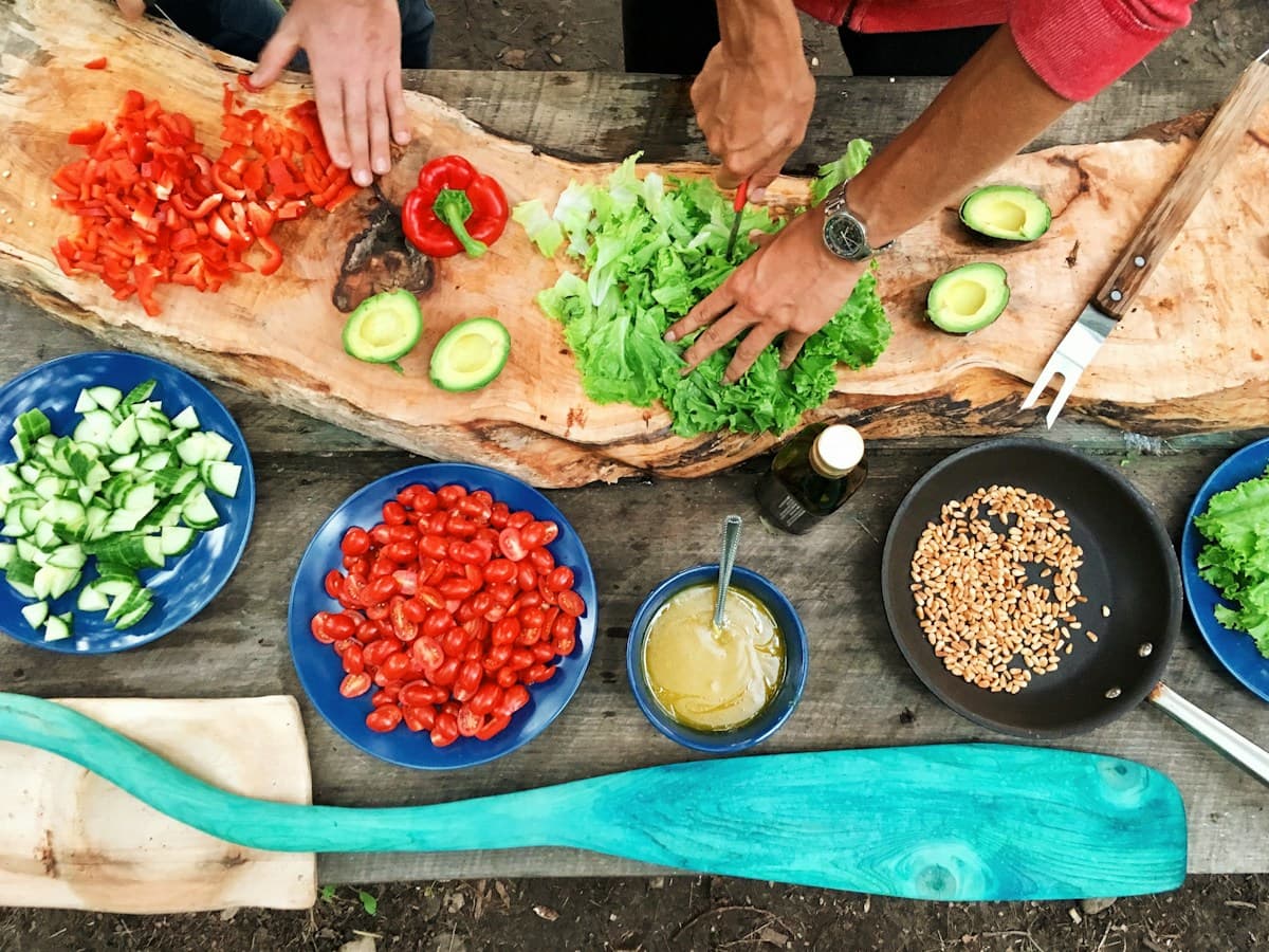 People preparing fresh vegetables together